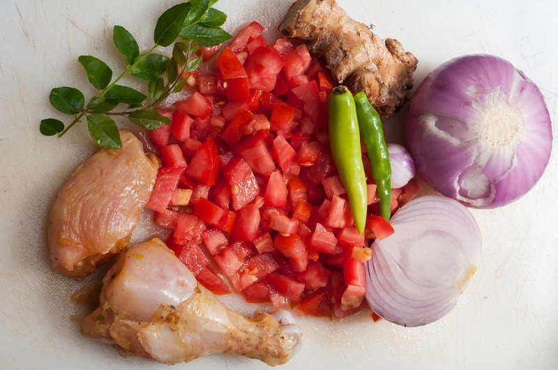 preparation and making slice of tomatoes, onions, chillies, chop the coriander leaves, and julienne the ginger